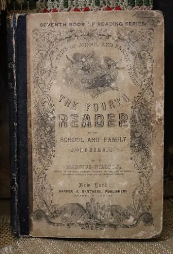 Child's Reader Wilson dated 1860 and Book Light